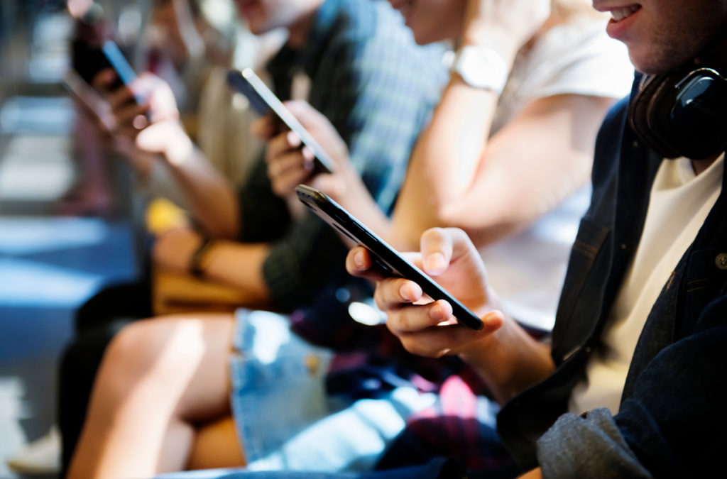 Group of people using their phones